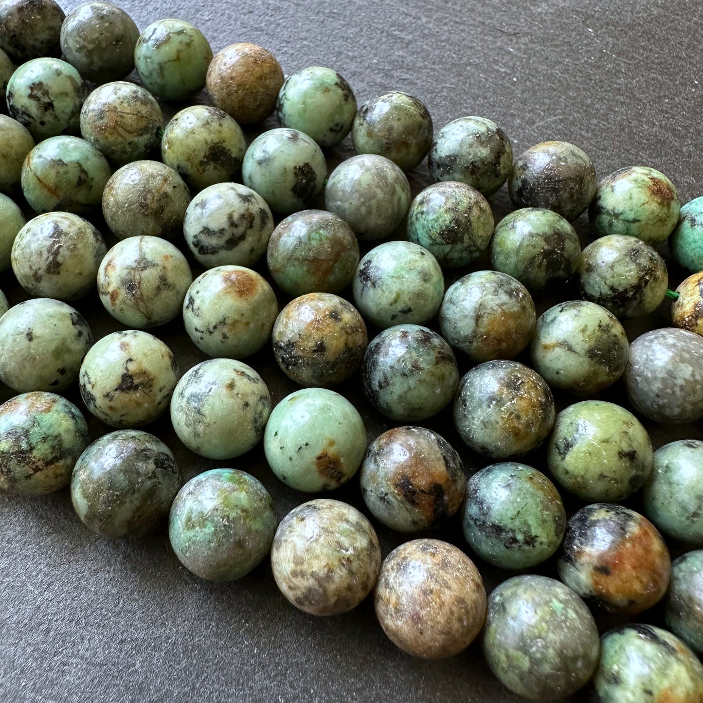 10mm african turquoise beads (undyed) - round - smooth - 15" strand - approx. 35 beads