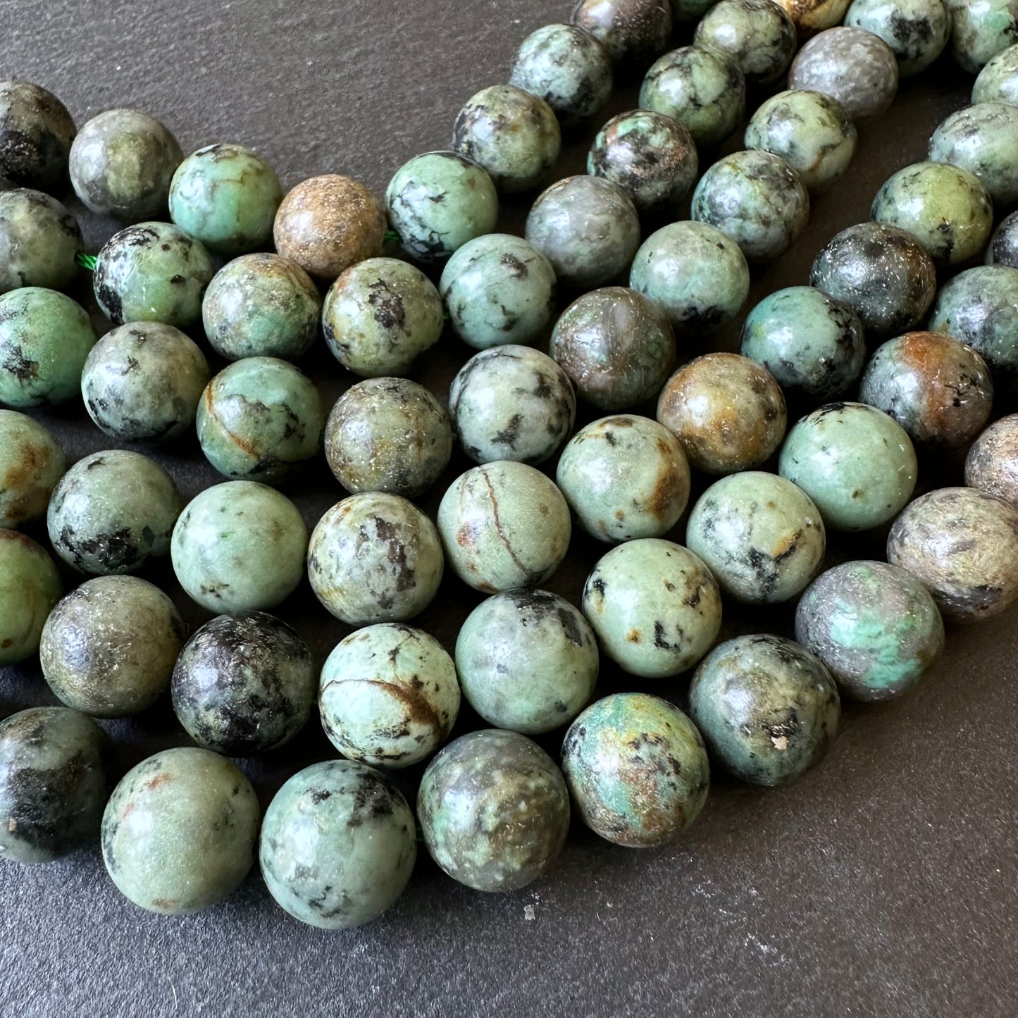 10mm african turquoise beads (undyed) - round - smooth - 15" strand - approx. 35 beads