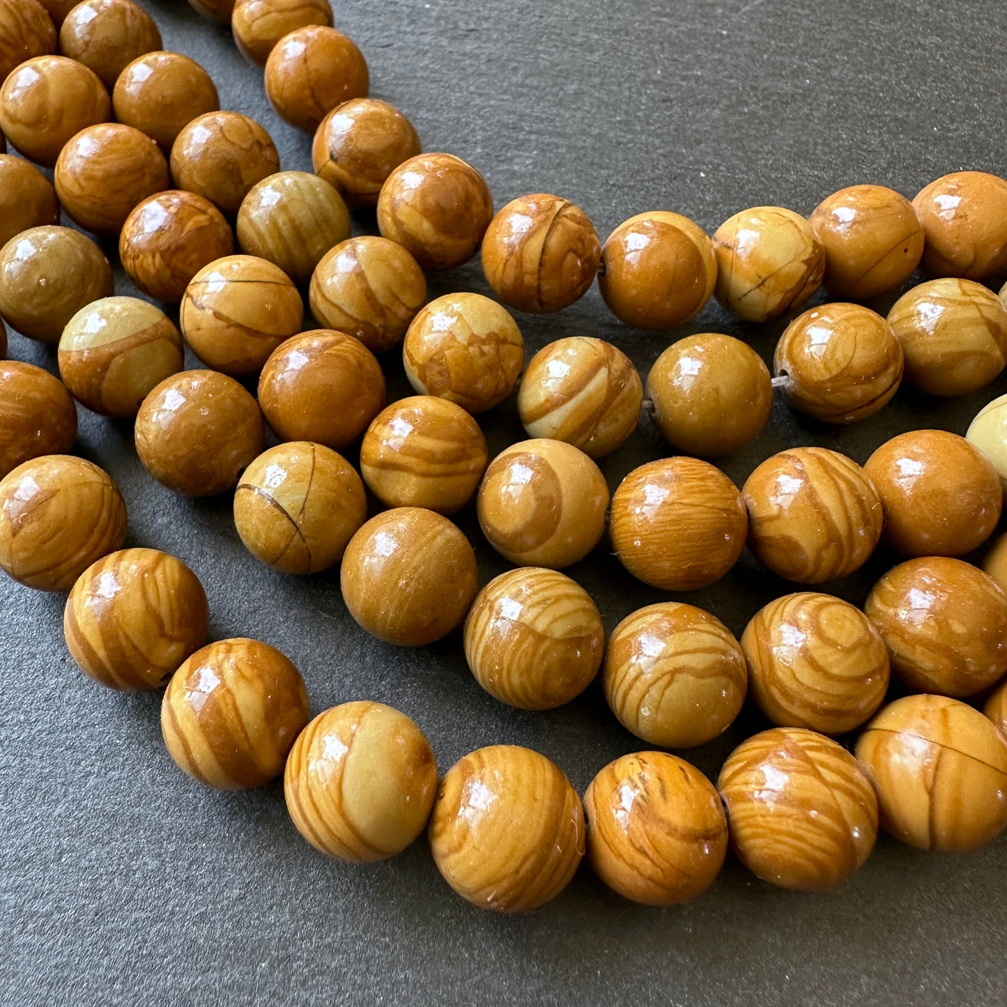 10mm wood lace jasper beads (undyed) - round - smooth - 15" strand - approx. 35 beads