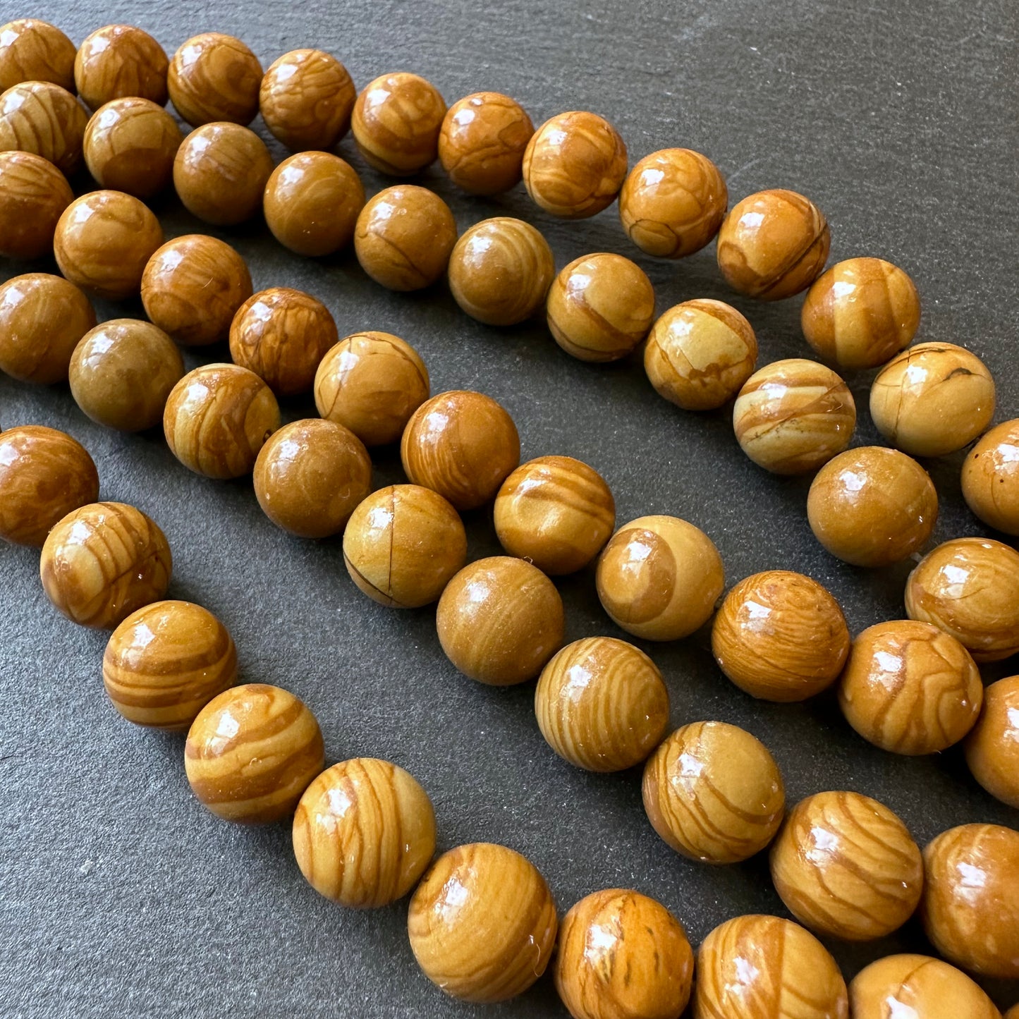 10mm wood lace jasper beads (undyed) - round - smooth - 15" strand - approx. 35 beads