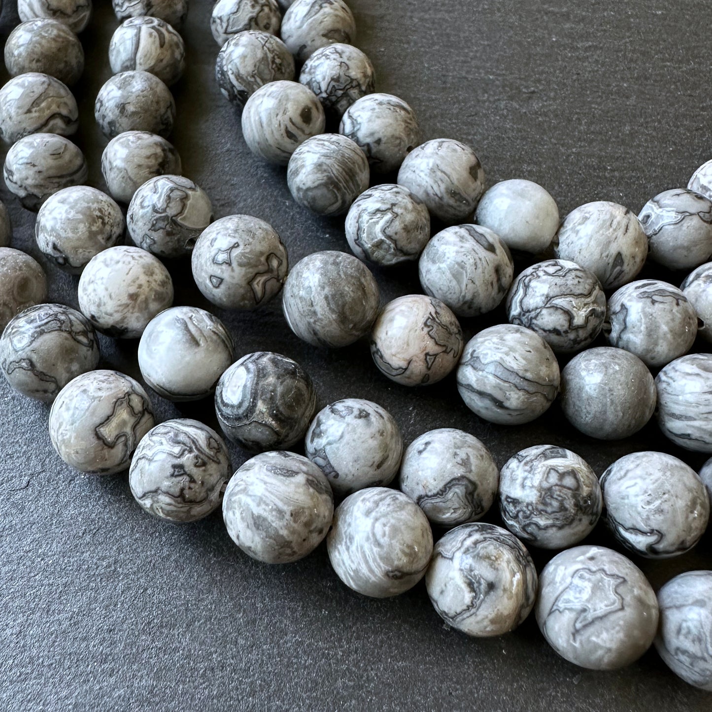 10mm netstone jasper beads (undyed)- round - smooth - 15" strand - approx. 35 beads