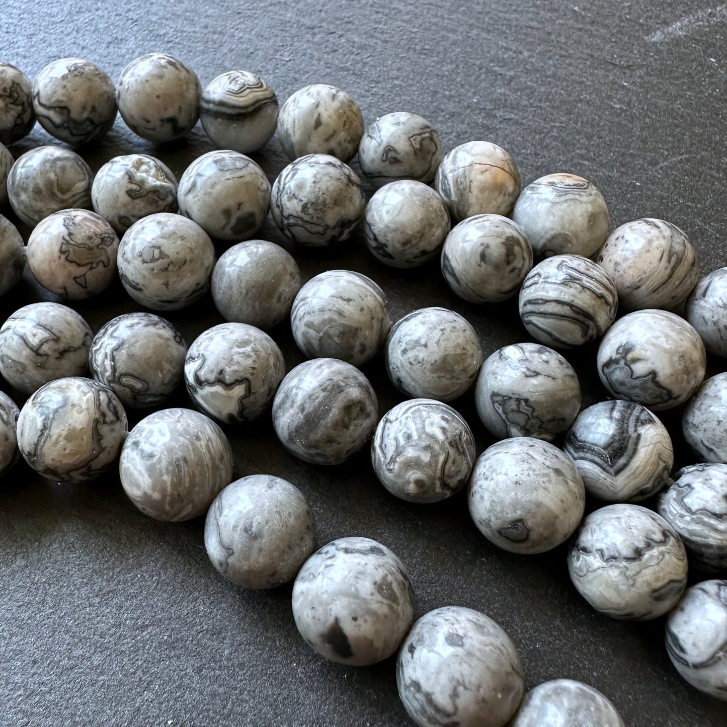 10mm netstone jasper beads (undyed)- round - smooth - 15" strand - approx. 35 beads