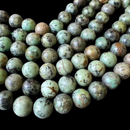 10mm african turquoise beads (undyed) - round - smooth - 15" strand - approx. 35 beads