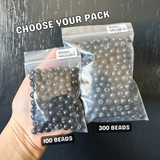 comparison of two black wood bead bag sizes of 100 beads and 300 beads for bracelet making diy