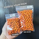 comparison of different package sizes of 8mm orange wood beads