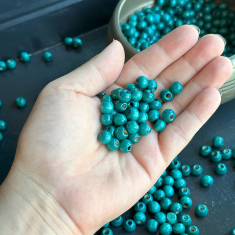 handful of 8mm blue wood beads for jewelry making