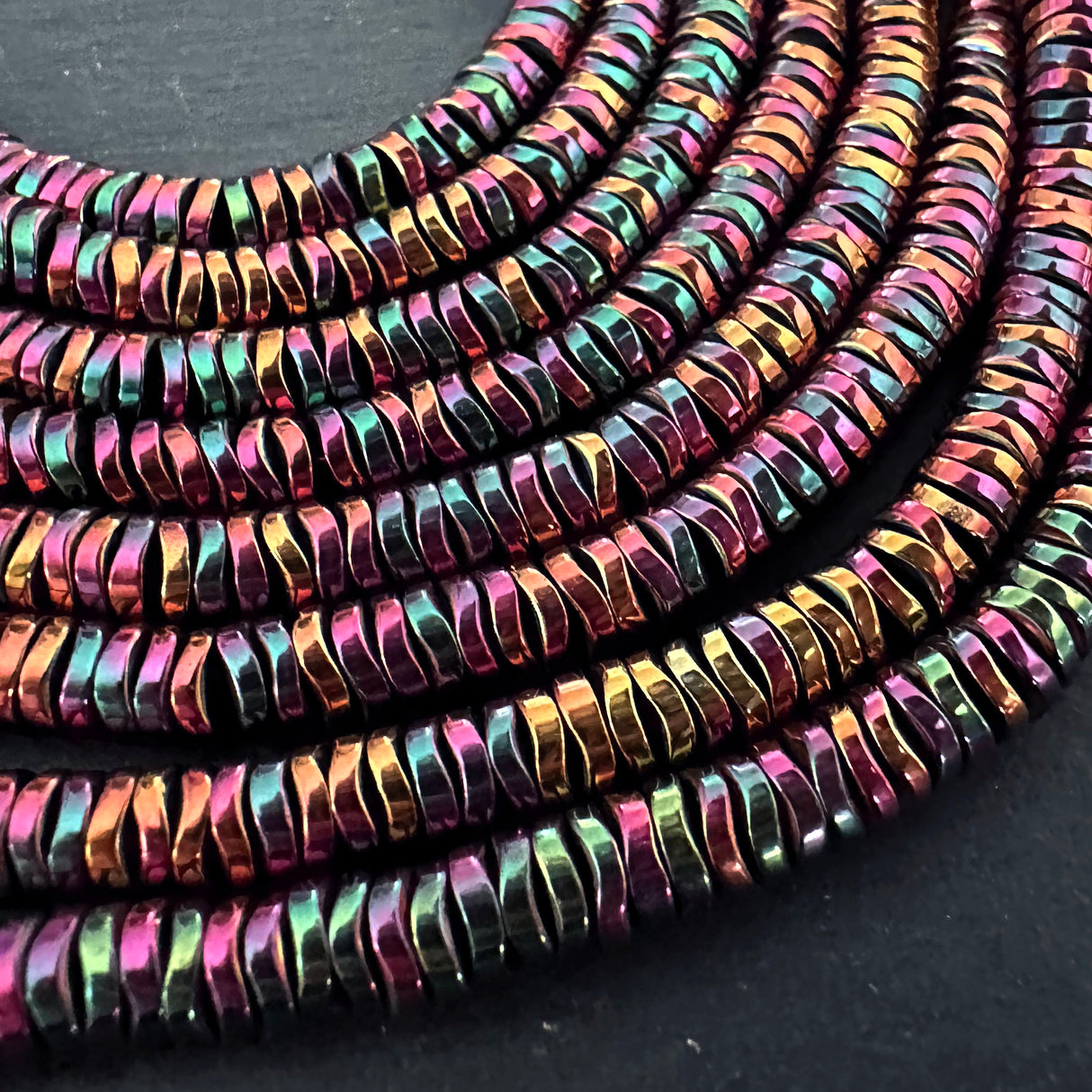 6mm rainbow electroplated hematite beads - disc - wavy - 16" strand - approx. 200 beads