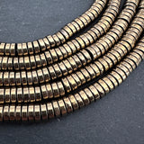 6mm light gold electroplated hematite - heishi - smooth - 15" strand - approx. 195 beads