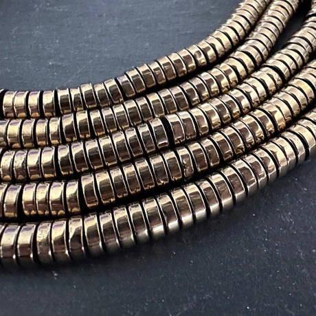 6mm light gold electroplated hematite - heishi - smooth - 15" strand - approx. 195 beads