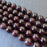 10mm garnet beads (undyed) - round - smooth - 15" strand - approx. 35 beads