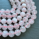 10mm rose quartz beads (undyed) - round - smooth - 15" strand - approx. 35 beads