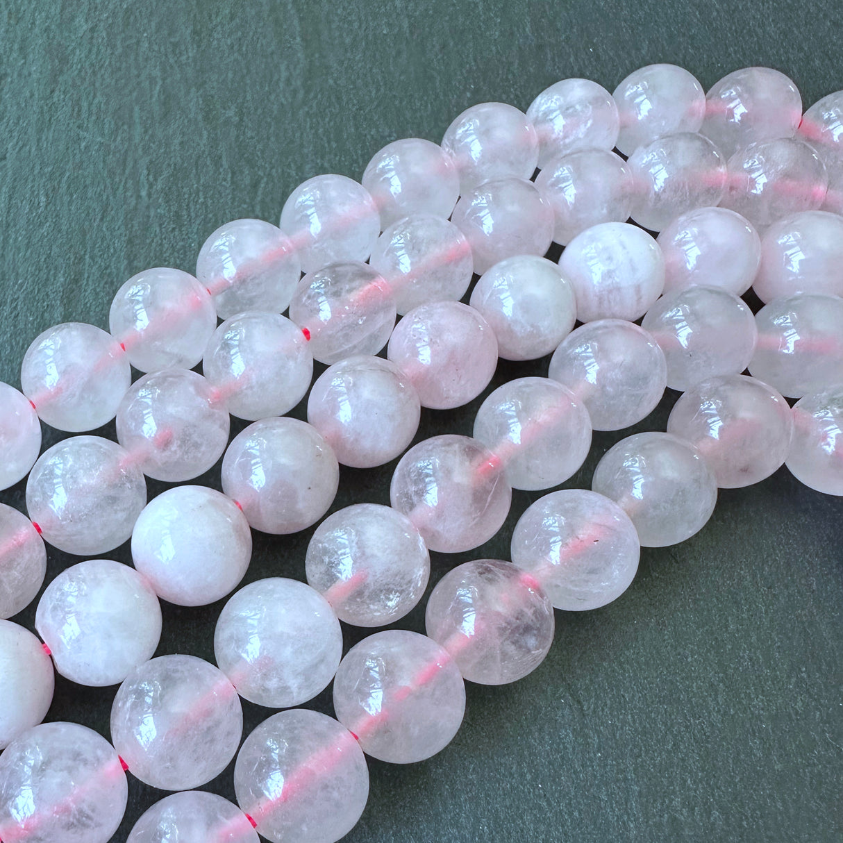 10mm rose quartz beads (undyed) - round - smooth - 15" strand - approx. 35 beads