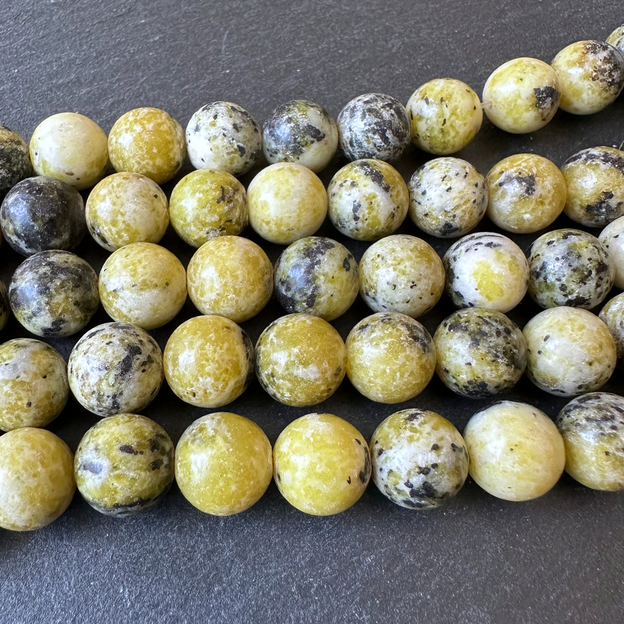 10mm yellow turquoise beads (undyed) - round - smooth - 15" strand - approx. 35 beads