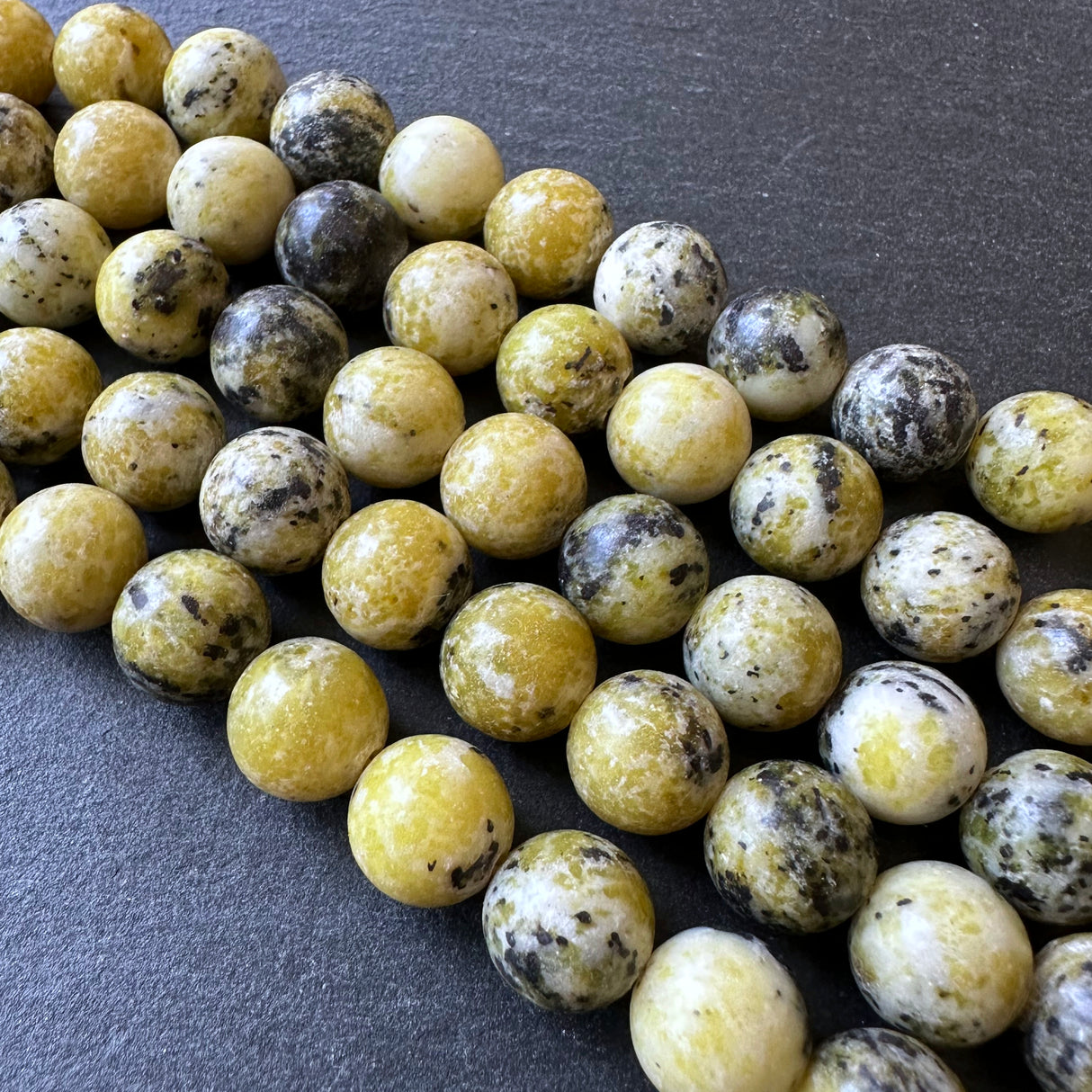 10mm yellow turquoise beads (undyed) - round - smooth - 15" strand - approx. 35 beads