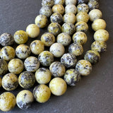 10mm yellow turquoise beads (undyed) - round - smooth - 15" strand - approx. 35 beads