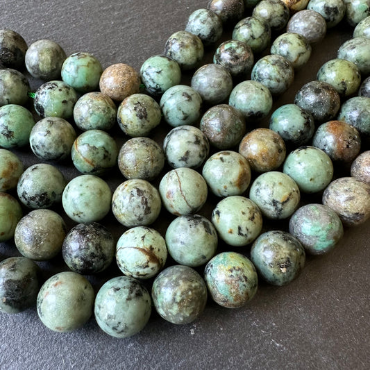 10mm african turquoise beads (undyed) - round - smooth - 15" strand - approx. 35 beads