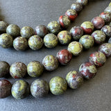 10mm dragon blood jasper beads - round - smooth - 15" strand - approx. 35 beads