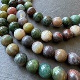 10mm indian agate beads (undyed) - round - smooth - 15" strand - approx. 35 beads