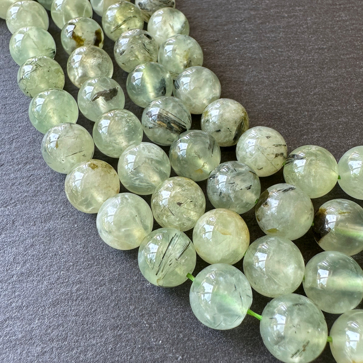 10mm prehnite beads (undyed) - round - smooth - 15" strand - approx. 35 beads