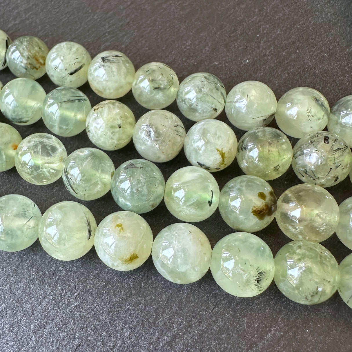 10mm prehnite beads (undyed) - round - smooth - 15" strand - approx. 35 beads