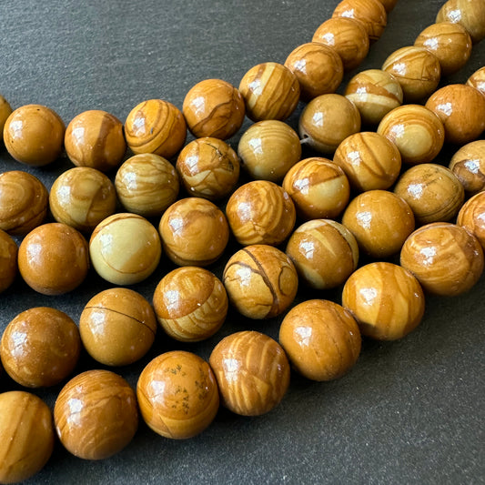 10mm wood lace jasper beads (undyed) - round - smooth - 15" strand - approx. 35 beads