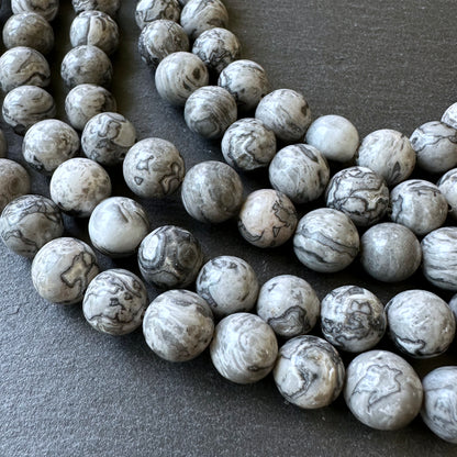 10mm netstone jasper beads (undyed)- round - smooth - 15" strand - approx. 35 beads