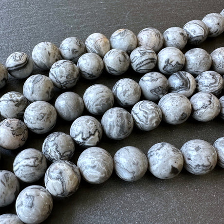 10mm netstone jasper beads (undyed)- round - smooth - 15" strand - approx. 35 beads