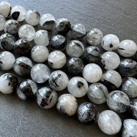 10mm black tourmalinated beads (undyed)- round - smooth - 15" strand - approx. 35 beads