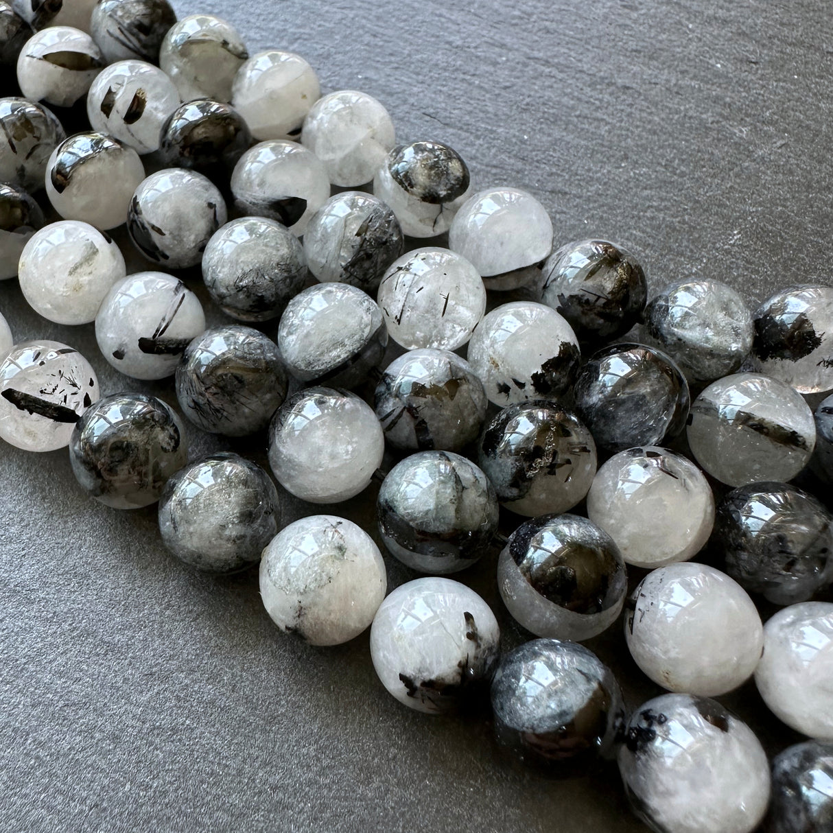 10mm black tourmalinated beads (undyed)- round - smooth - 15" strand - approx. 35 beads