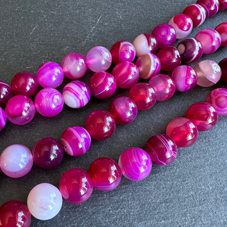 10mm pink striped agate beads - round - smooth - 15" strand - approx. 35 beads