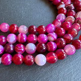 10mm pink striped agate beads - round - smooth - 15" strand - approx. 35 beads