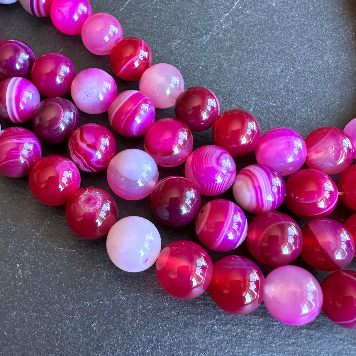 10mm pink striped agate beads - round - smooth - 15" strand - approx. 35 beads