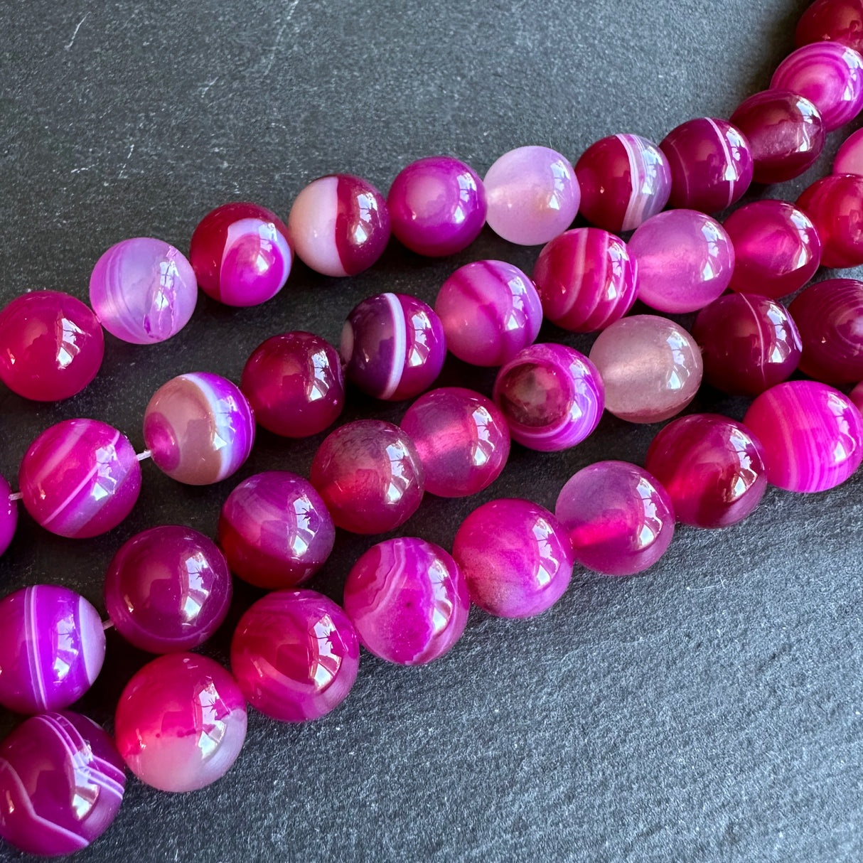 10mm pink striped agate beads - round - smooth - 15" strand - approx. 35 beads