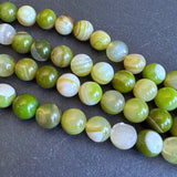 10mm lime green striped agate beads - round - smooth - 15" strand - approx. 35 beads