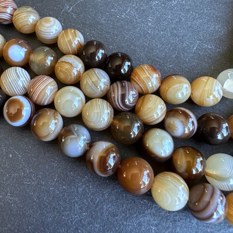 10mm dark brown striped agate beads - round - smooth - 15" strand - approx. 35 beads