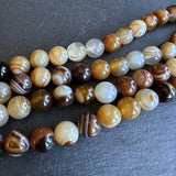 10mm dark brown striped agate beads - round - smooth - 15" strand - approx. 35 beads