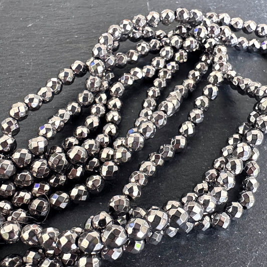 4mm silver electroplated hematite - round - faceted - 15" strand - approx. 100 beads
