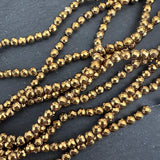 4mm gold electroplated hematite beads - round - faceted - 15" strand - approx. 100 beads