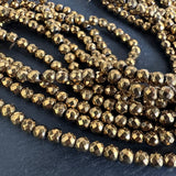 4mm gold electroplated hematite beads - round - faceted - 15" strand - approx. 100 beads