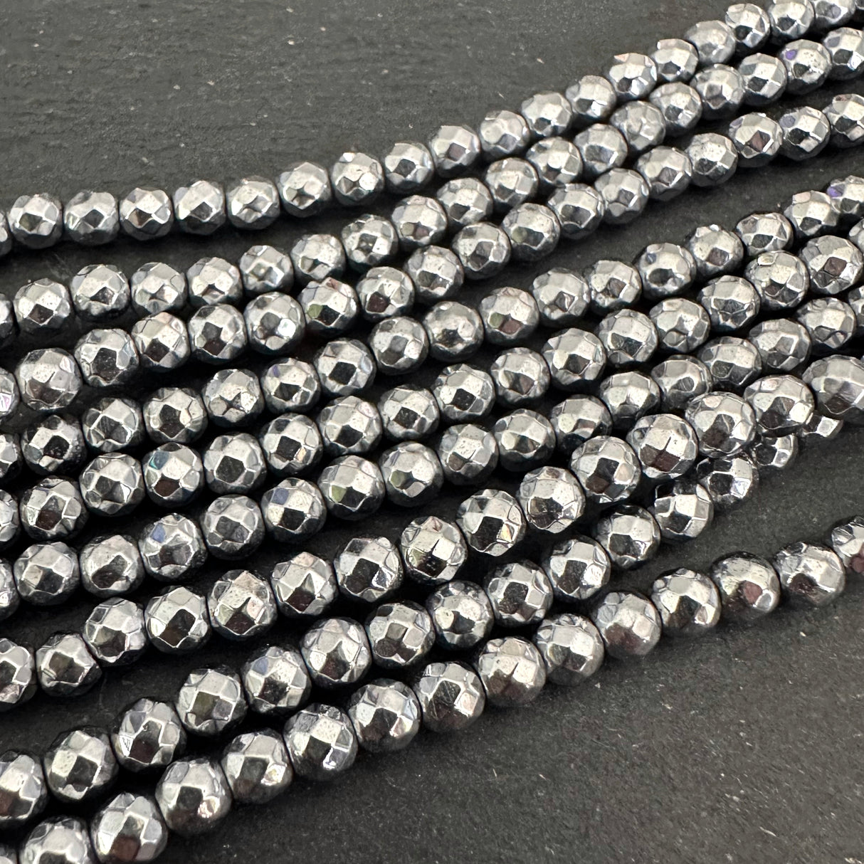 4mm platinum silver electroplated hematite beads - round - faceted - 15" strand - approx. 100 beads