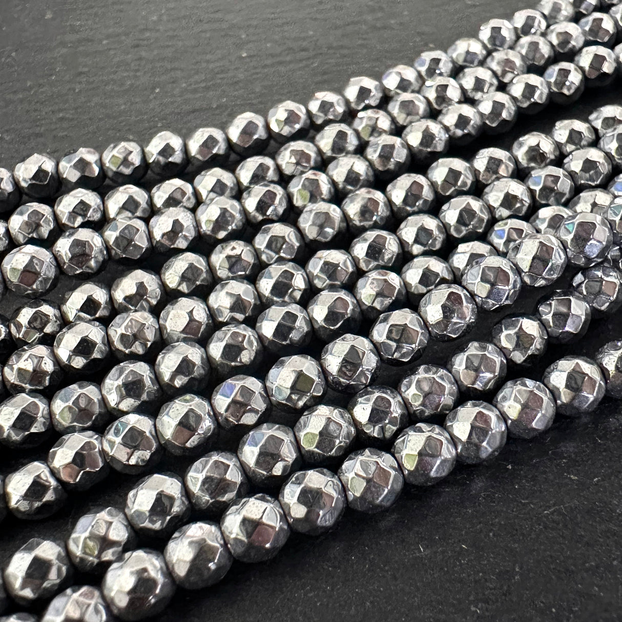 4mm platinum silver electroplated hematite beads - round - faceted - 15" strand - approx. 100 beads