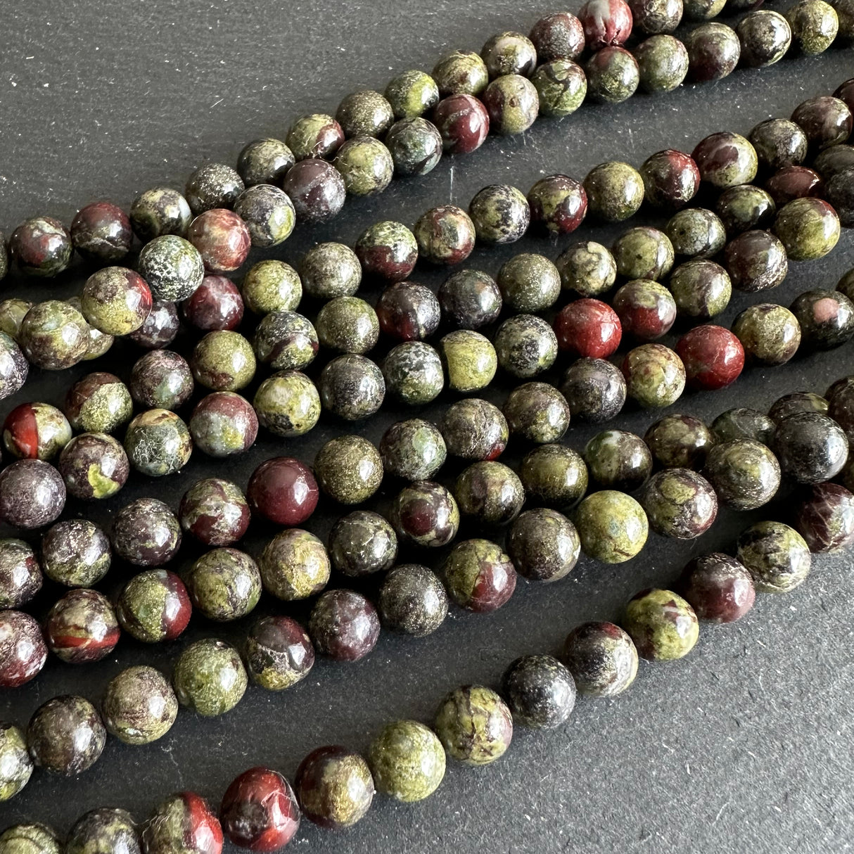 6mm dragon blood jasper beads - round - smooth - 15" strand - approx. 65 beads