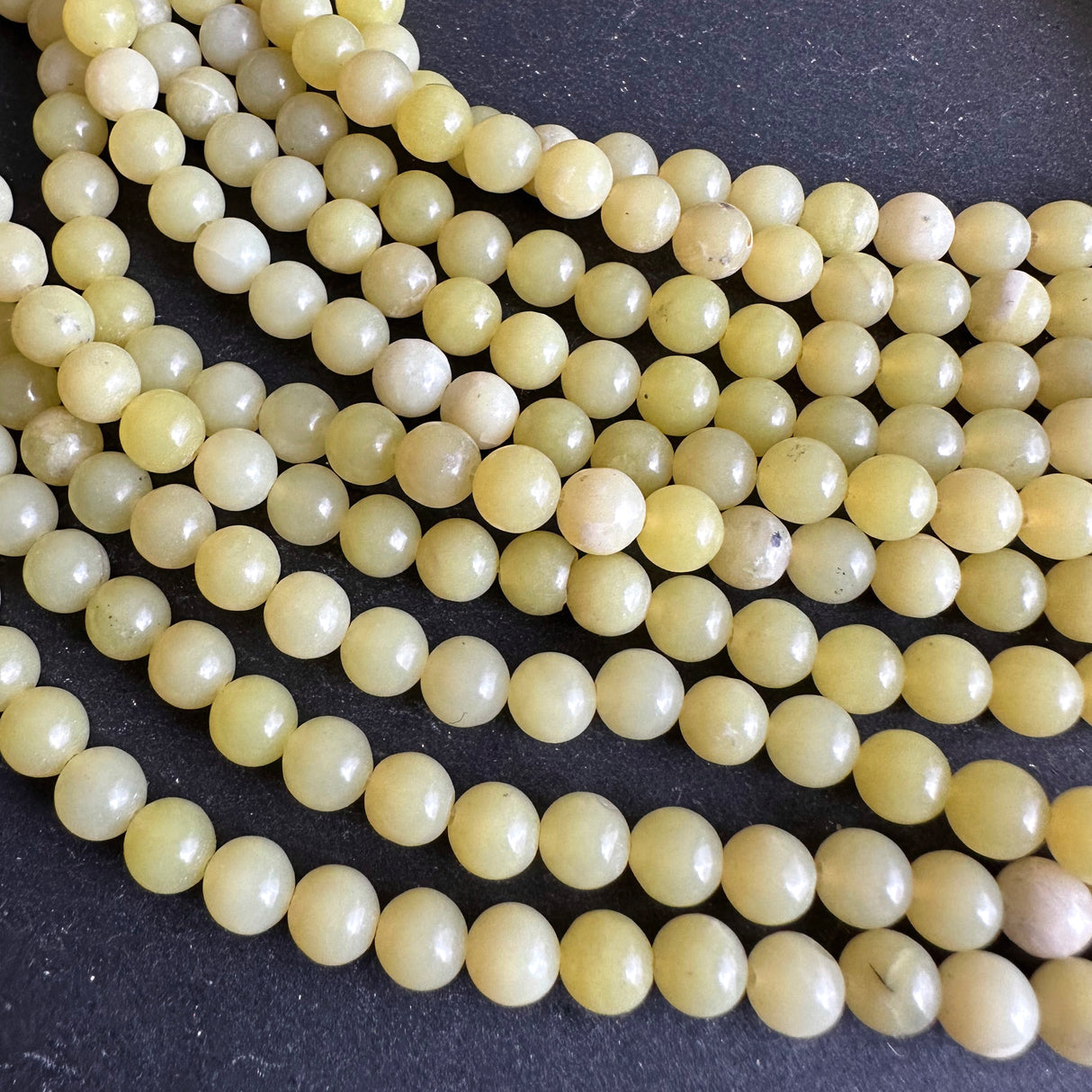 6mm lemon jade beads - round - smooth - 15" strand - approx. 65 beads