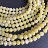 6mm lemon jade beads - round - smooth - 15" strand - approx. 65 beads