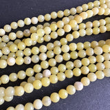 6mm lemon jade beads - round - smooth - 15" strand - approx. 65 beads