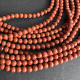 6mm goldstone beads (glass) - round - smooth - 15" strand - approx. 65 beads