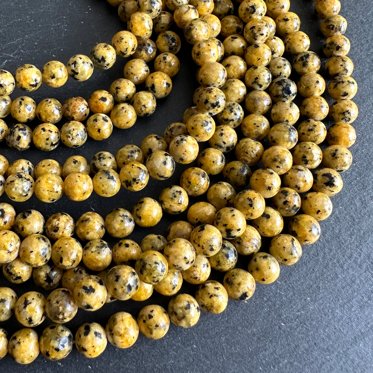 6mm yellow sesame jasper beads (dyed) - round - smooth - 15" strand - approx. 65 beads