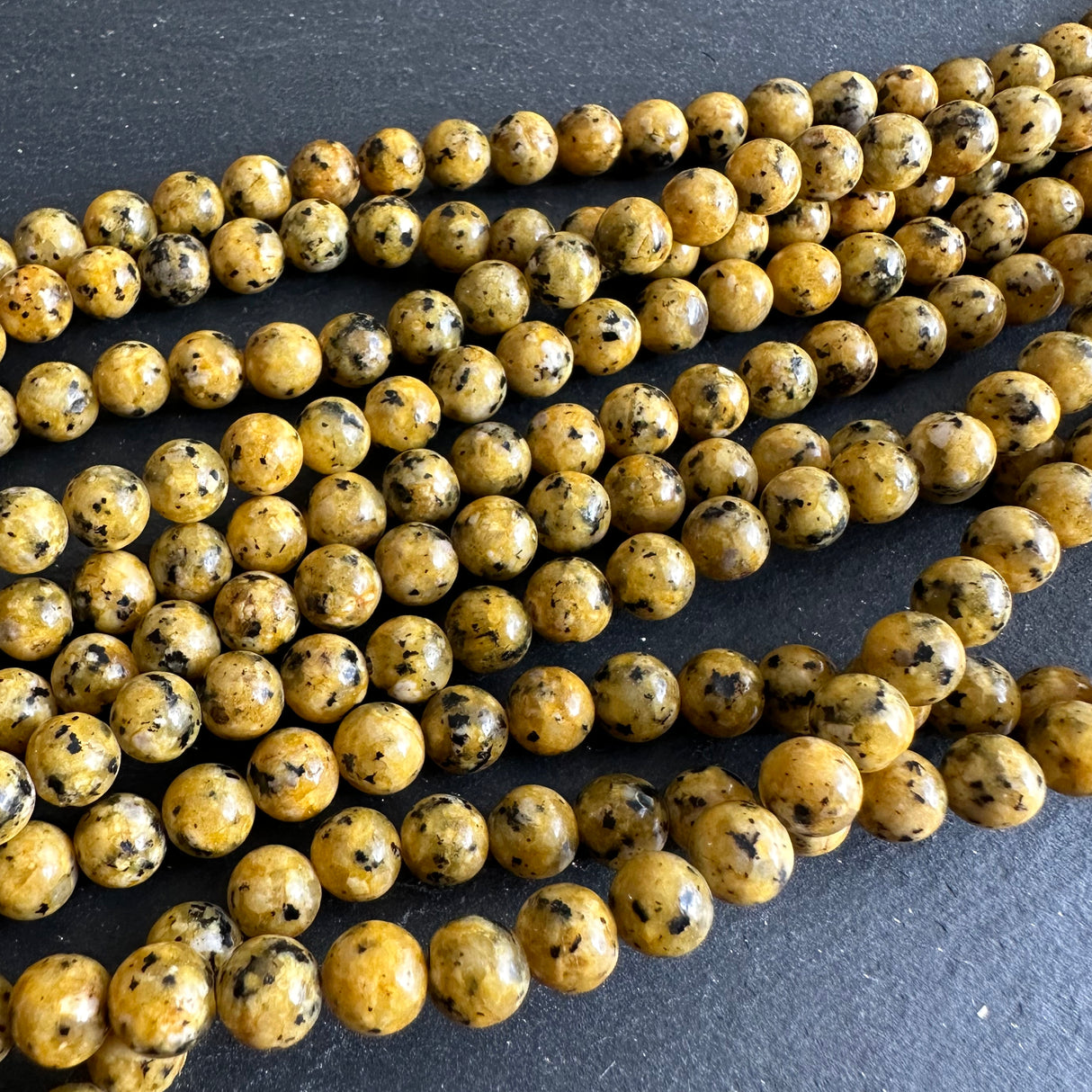 6mm yellow sesame jasper beads (dyed) - round - smooth - 15" strand - approx. 65 beads