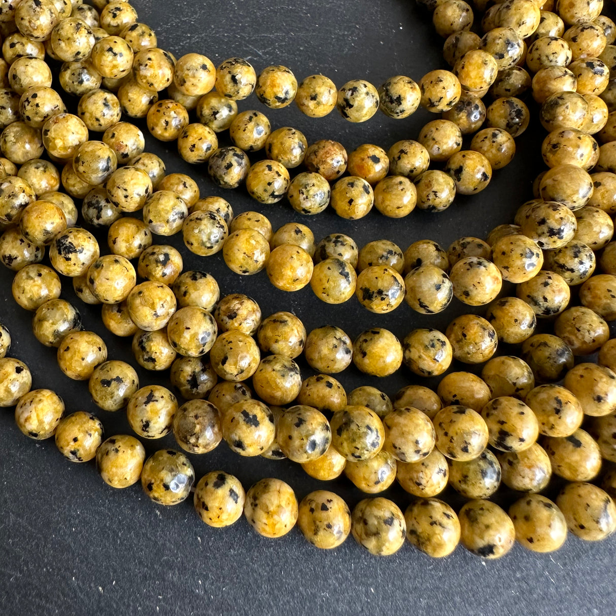 6mm yellow sesame jasper beads (dyed) - round - smooth - 15" strand - approx. 65 beads