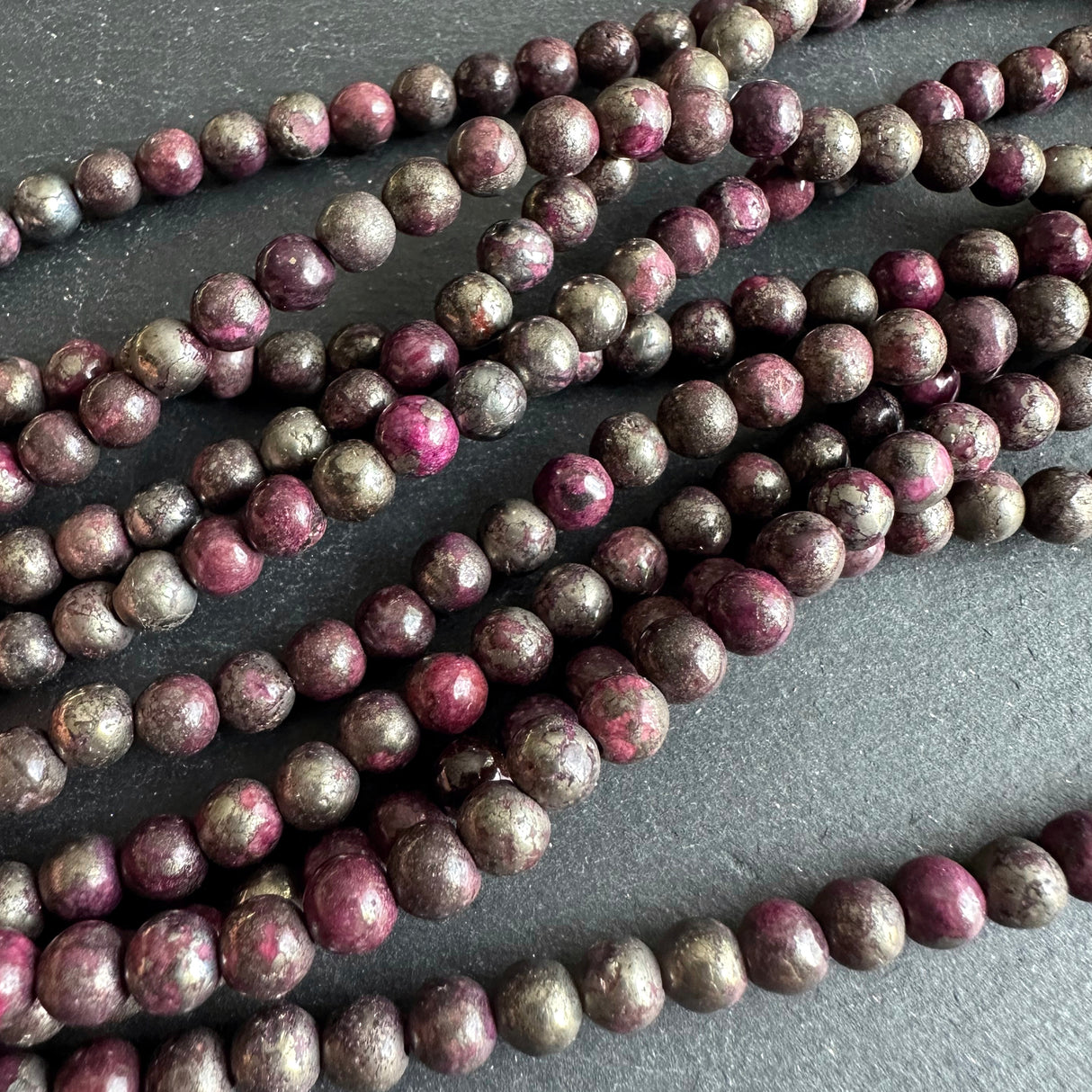 6mm pink pyrite stone beads - round - smooth - 15" strand - approx. 65 beads